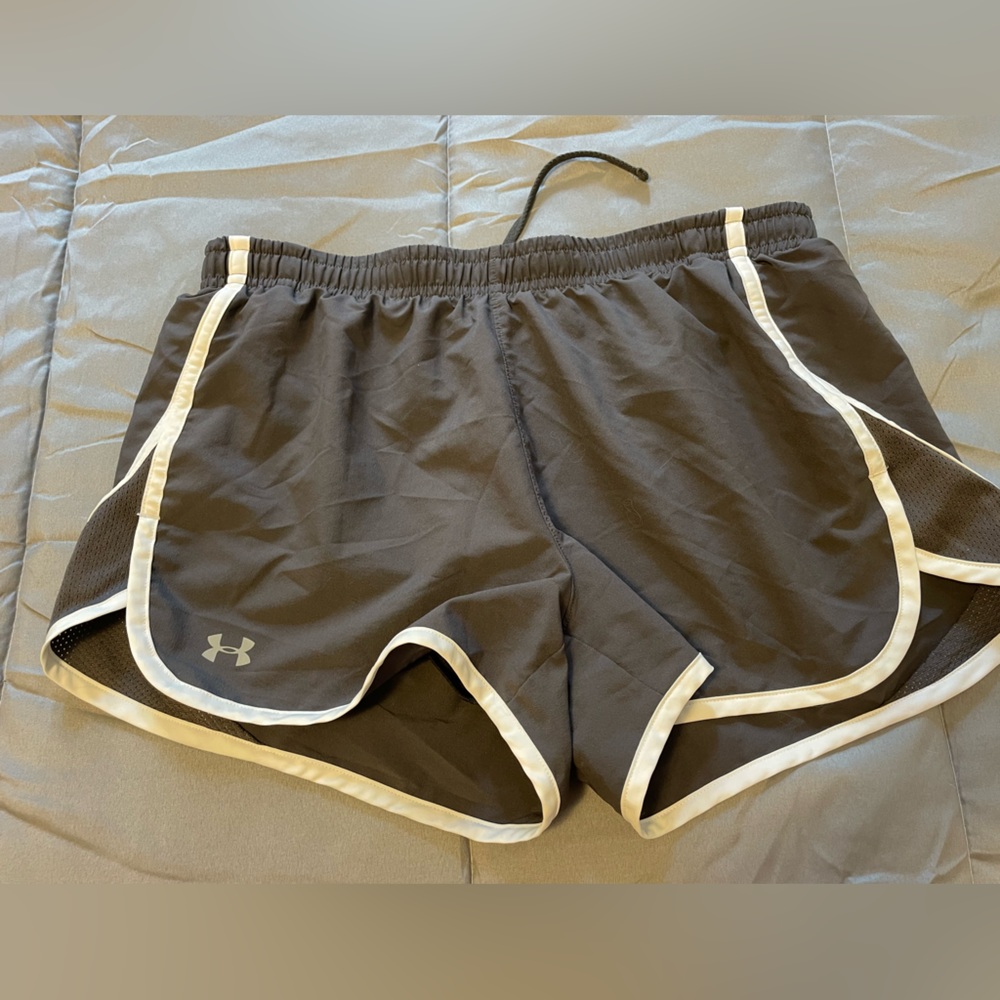 Small heat gear UA shorts. Good condition. Gray with white.